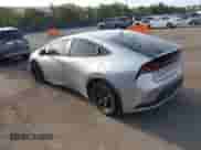 2025 Toyota Prius LE with VIN JTDACAAU4S3052719, listed as a IAAI auction lot 43175096 with 23,082 mi miles and . Bid and sale history available at DreamBid. Image 3.