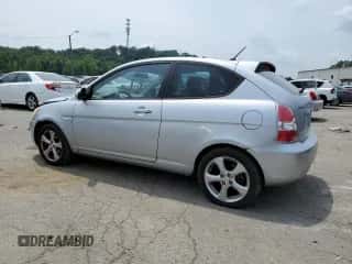 2007 Hyundai Accent SE with VIN KMHCN36CX7U038061, listed as a Copart auction lot 63790134 with 104,618 mi miles and Salvage title. Bid and sale history available at DreamBid. Image 2.