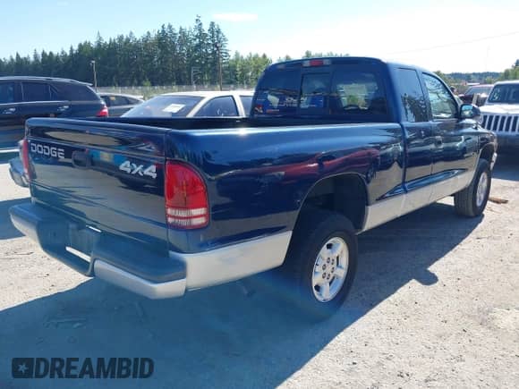 2002 Dodge Dakota SLT with VIN 1B7GG42N22S659506, listed as a IAAI auction lot 42838603 with 98,470 mi miles and . Bid and sale history available at DreamBid. Image 4.