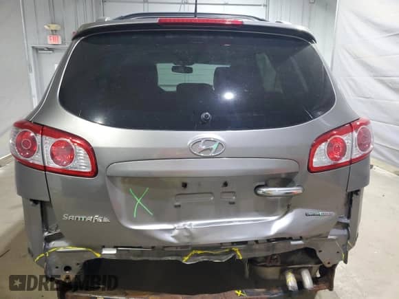 2012 Hyundai Santa Fe Limited с VIN 5XYZKDAG5CG144226, выставлен на аукционе Copart как лот 70772505 с пробегом 176 332 миль миль и Списание • Salvage title. История ставок и продаж доступна на DreamBid. Изображение 6.
