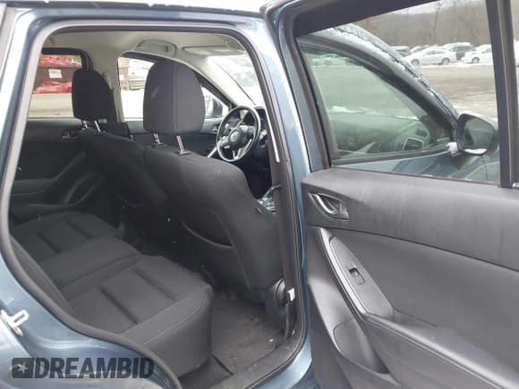 ✅ 2016 Mazda CX-5 Touring • VIN: JM3KE4CY6G0874938 • Lot: 43869585. Listed on IAAI with 180,000 mi. Free auction sales archive from the USA and detailed vehicle history report at DreamBid. Image 8.