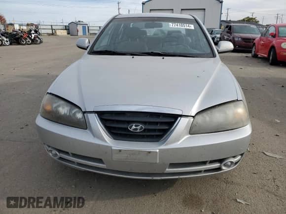 2005 Hyundai Elantra GLS z VIN KMHDN46D75U115937, wystawiony jako Copart lot #77410514 z przebiegiem 128 015 mil mil oraz Szkoda całkowita • Salvage title. Historia ofert i sprzedaży dostępna na DreamBid. Obrazek 5.