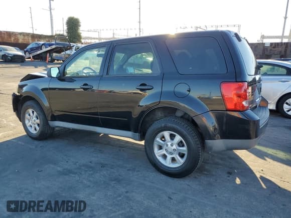 ✅ 2010 Mazda Tribute Sport • VIN: 4F2CY0C79AKM02667 • Lot: 90007105. Listed on Copart with 131,715 mi. Free auction sales archive from the USA and detailed vehicle history report at DreamBid. Image 2.