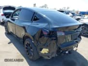 ✅ 2023 Tesla Model Y Long Range • VIN: 7SAYGDEE0PA023719 • Lot: 41974415. Listed on IAAI with 50,152 mi. Free auction sales archive from the USA and detailed vehicle history report at DreamBid. Image 3.