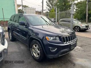 ✅ 2014 Jeep Grand Cherokee Laredo • VIN: 1C4RJFAG0EC109809 • Lot: 86532235. Listed on Copart with 251,606 mi. Free auction sales archive from the USA and detailed vehicle history report at DreamBid. Image 1.