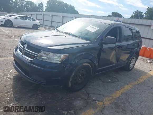 2015 Dodge Journey American Value z VIN 3C4PDCABXFT610861, wystawiony jako IAAI lot #43068421 z przebiegiem 153 937 mil mil oraz . Historia ofert i sprzedaży dostępna na DreamBid. Obrazek 17.