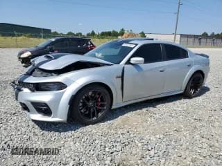 ✅ 2022 Dodge Charger Scat Pack Widebody • VIN: 2C3CDXGJ5NH136642 • Лот: 81021805. Опубликован ранее на Copart с пробегом 38 611 миль. Бесплатный доступ к архиву аукционных продаж из США и подробный отчёт об истории автомобиля на DreamBid. Изображение 1.