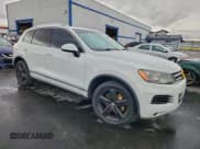 ✅ 2013 Volkswagen Touareg Sport • VIN: WVGEP9BP6DD004242 • Lot: 94153945. Listed on Copart with 185,915 mi. Free auction sales archive from the USA and detailed vehicle history report at DreamBid. Image 4.