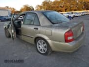 ✅ 2003 Mazda Protege DX • VIN: JM1BJ225230154255 • Лот: 84426944. Опубликован ранее на Copart с пробегом Не указан. Бесплатный доступ к архиву аукционных продаж из США и подробный отчёт об истории автомобиля на DreamBid. Изображение 2.
