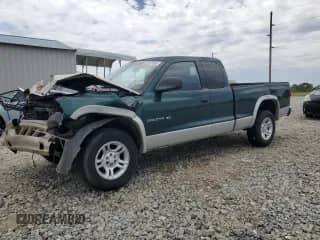 2001 Dodge Dakota Sport with VIN 1B7GG22N71S276664, listed as a Copart auction lot 55327385 with 219,514 mi miles and Salvage title. Bid and sale history available at DreamBid. Image 1.