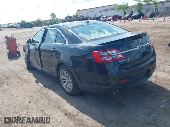 ✅ 2014 Ford Taurus Limited • VIN: 1FAHP2F85EG125118 • Lot: 42457437. Listed on IAAI with 129,406 mi. Free auction sales archive from the USA and detailed vehicle history report at DreamBid. Image 3.