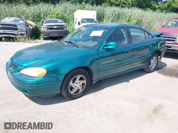 ✅ 1999 Pontiac Grand Am SE1 • VIN: 1G2NE52E0XC574219 • Lot: 42824816. Wystawiony na IAAI z przebiegiem 192 748 mil. Bezpłatny archiwum sprzedaży aukcyjnych z USA i szczegółowy raport historii pojazdu na DreamBid. Zdjęcie 2.