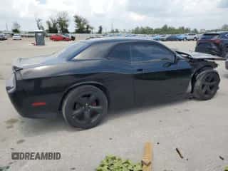 2012 Dodge Challenger SXT z VIN 2C3CDYAG7CH269659, wystawiony jako Copart lot #66377564 z przebiegiem 124 426 mil mil oraz Czysty tytuł • Clean title. Historia ofert i sprzedaży dostępna na DreamBid. Obrazek 3.