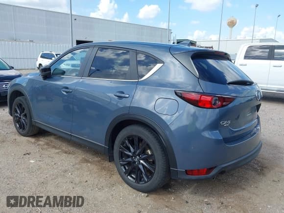 ✅ 2021 Mazda CX-5 Carbon Edition • VIN: JM3KFBCY0M0458896 • Лот: 42512723. Опубликован ранее на IAAI с пробегом 27 488 миль. Бесплатный доступ к архиву аукционных продаж из США и подробный отчёт об истории автомобиля на DreamBid. Изображение 3.