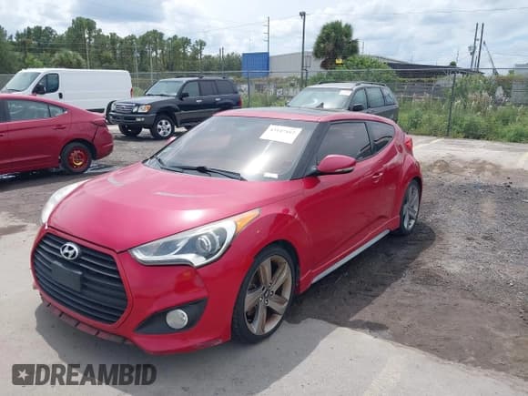 ✅ 2013 Hyundai Veloster Turbo • VIN: KMHTC6AE2DU129756 • Lot: 43147167. Listed on IAAI with 88,763 mi. Free auction sales archive from the USA and detailed vehicle history report at DreamBid. Image 2.