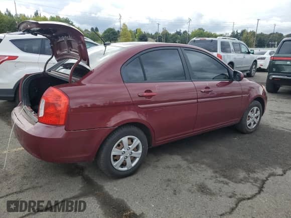 2010 Hyundai Accent GLS z VIN KMHCN4AC9AU423907, wystawiony jako Copart lot #85865405 z przebiegiem 161 041 mil mil oraz Szkoda całkowita • Salvage title. Historia ofert i sprzedaży dostępna na DreamBid. Obrazek 3.
