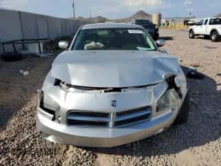 2010 Dodge Charger SXT с VIN 2B3CA3CV8AH309636, выставлен на аукционе Copart как лот 70725114 с пробегом 126 011 миль миль и Списание • Salvage title. История ставок и продаж доступна на DreamBid. Изображение 5.