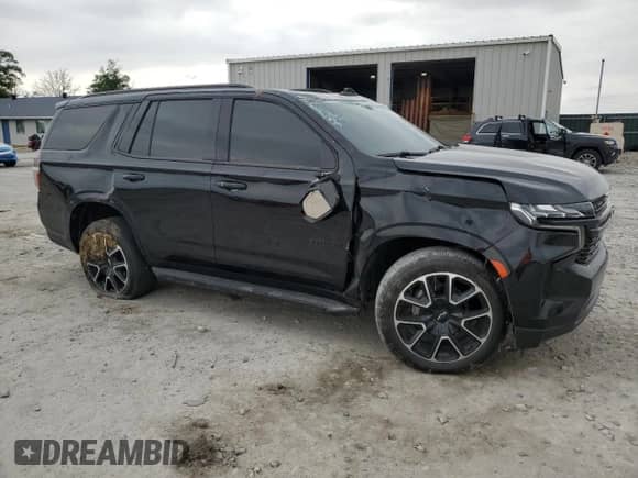 2023 Chevrolet Tahoe RST with VIN 1GNSKRKT1PR132227, listed as a Copart auction lot 57033255 with 30,133 mi miles and Salvage title. Bid and sale history available at DreamBid. Image 4.