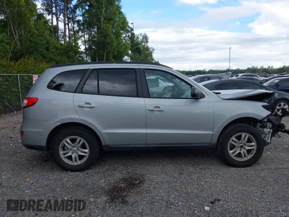 2010 Hyundai Santa Fe GLS z VIN 5NMSG3AB5AH410865, wystawiony jako IAAI lot #43519914 z przebiegiem Nie podano mil oraz . Historia ofert i sprzedaży dostępna na DreamBid. Obrazek 13.