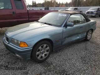 1994 BMW 3 Series 318i with VIN WBABK532XREC82743, listed as a Copart auction lot 77685874 with 194,919 mi miles and Salvage title. Bid and sale history available at DreamBid. Image 1.