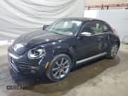 ✅ 2014 Volkswagen Beetle 2.0L TDI w/Sun/Sound/Nav • VIN: 3VWJL7AT0EM656309 • Лот: 68018735. Опубликован ранее на Copart с пробегом 117 222 миль. Бесплатный доступ к архиву аукционных продаж из США и подробный отчёт об истории автомобиля на DreamBid. Изображение 1.