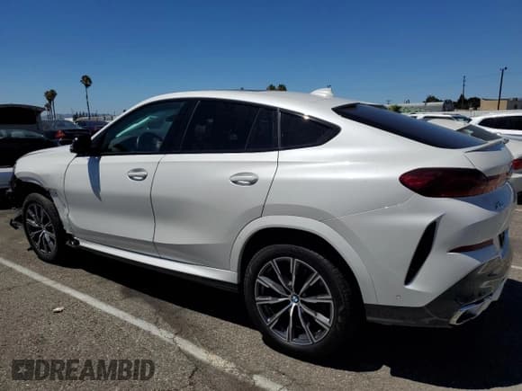 ✅ 2023 BMW X6 xDrive40i • VIN: 5UXCY6C00P9N62599 • Лот: 64871833. Опубликован ранее на Copart с пробегом 20 319 миль. Бесплатный доступ к архиву аукционных продаж из США и подробный отчёт об истории автомобиля на DreamBid. Изображение 2.