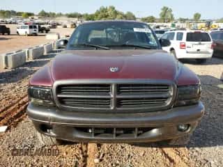 2002 Dodge Dakota z VIN 1B7GG12XX2S570878, wystawiony jako Copart lot #75023704 z przebiegiem 109 421 mil mil oraz Szkoda całkowita • Salvage title. Historia ofert i sprzedaży dostępna na DreamBid. Obrazek 5.