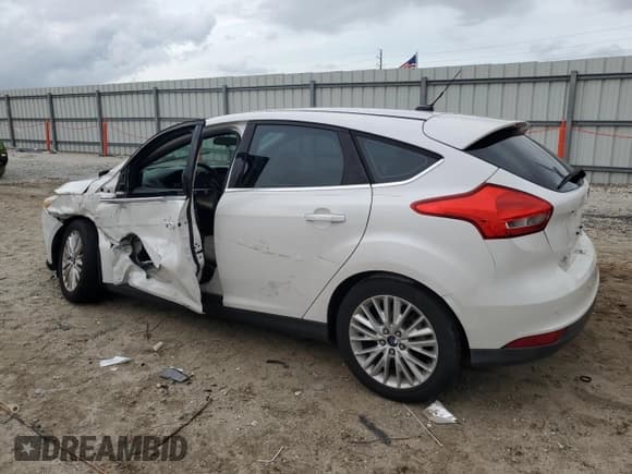✅ 2016 Ford Focus Titanium • VIN: 1FADP3N27GL242243 • Лот: 90424575. Опубликован ранее на Copart с пробегом 58 813 миль. Бесплатный доступ к архиву аукционных продаж из США и подробный отчёт об истории автомобиля на DreamBid. Изображение 2.