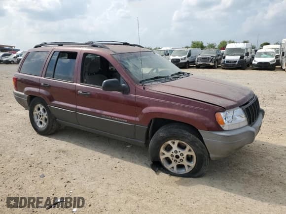 ✅ 1999 Jeep Grand Cherokee Laredo • VIN: 1J4G258S0XC563922 • Лот: 55491645. Опубликован ранее на Copart с пробегом Не указан. Бесплатный доступ к архиву аукционных продаж из США и подробный отчёт об истории автомобиля на DreamBid. Изображение 4.