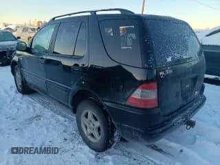 ✅ 2000 Mercedes-Benz M 320/430/500 • VIN: 4JGAB54E9YA184826 • Lot: 92858995. Listed on Copart with 134,847 mi. Free auction sales archive from the USA and detailed vehicle history report at DreamBid. Image 2.