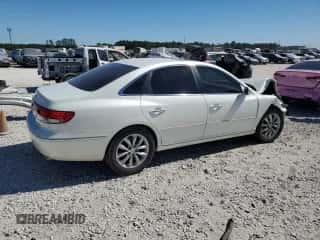 2006 Hyundai Azera SE z VIN KMHFC46F76A112099, wystawiony jako Copart lot #76604094 z przebiegiem Nie podano mil oraz Szkoda całkowita • Salvage title. Historia ofert i sprzedaży dostępna na DreamBid. Obrazek 3.