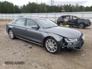 ✅ 2015 Audi A8 4.0T • VIN: WAU32AFDXFN002029 • Лот: 85853565. Опубликован ранее на Copart с пробегом 143 818 миль. Бесплатный доступ к архиву аукционных продаж из США и подробный отчёт об истории автомобиля на DreamBid. Изображение 4.