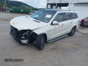 ✅ 2015 Mercedes-Benz GL 550 • VIN: 4JGDF7DE4FA555627 • Лот: 42592068. Опубликован ранее на IAAI с пробегом 153 965 миль. Бесплатный доступ к архиву аукционных продаж из США и подробный отчёт об истории автомобиля на DreamBid. Изображение 2.