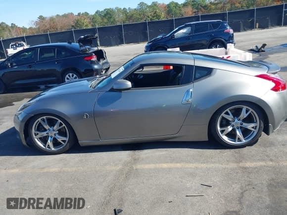 ✅ 2009 Nissan 370Z Touring • VIN: JN1AZ44E39M404491 • Lot: 43672244. Listed on IAAI with 118,427 mi. Free auction sales archive from the USA and detailed vehicle history report at DreamBid. Image 14.