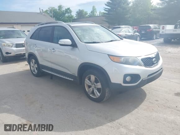 ✅ 2012 Kia Sorento EX • VIN: 5XYKUDA21CG235090 • Lot: 42386362. Listed on IAAI with 163,595 mi. Free auction sales archive from the USA and detailed vehicle history report at DreamBid. Image 1.