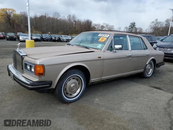✅ 1985 Rolls-Royce Silver Spirit • VIN: SCAZS42A4FCX13626 • Lot: 92029415. Listed on Copart with 57,329 mi. Free auction sales archive from the USA and detailed vehicle history report at DreamBid. Image 1.