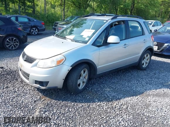 ✅ 2012 Suzuki SX4 Crossover • VIN: JS2YB5A3XC6300736 • Lot: 42428403. Listed on IAAI with 153,499 mi. Free auction sales archive from the USA and detailed vehicle history report at DreamBid. Image 2.