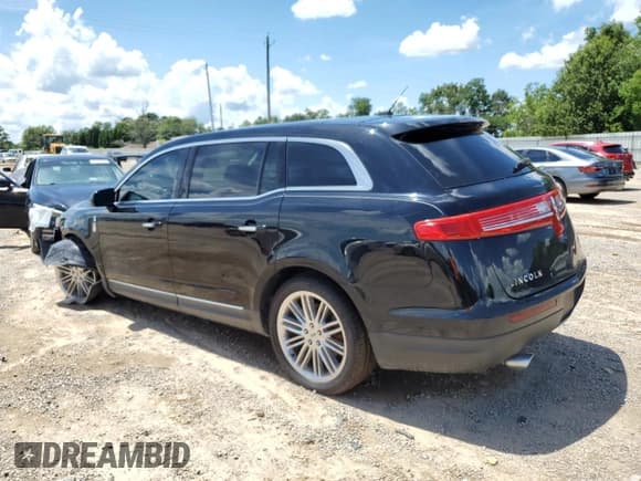 ✅ 2016 Lincoln MKT EcoBoost • VIN: 2LMHJ5AT7GBL01086 • Lot: 64059635. Listed on Copart with 60,617 mi. Free auction sales archive from the USA and detailed vehicle history report at DreamBid. Image 2.