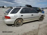 ✅ 1999 Subaru Impreza L • VIN: JF1GF4351XH815210 • Lot: 71250504. Listed on Copart with 141,806 mi. Free auction sales archive from the USA and detailed vehicle history report at DreamBid. Image 3.