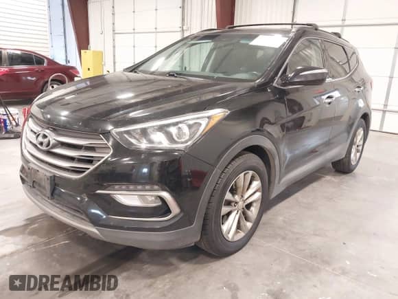 2017 Hyundai Santa Fe 2.0T z VIN 5XYZUDLA9HG433491, wystawiony jako IAAI lot #43298379 z przebiegiem 135 099 mil mil oraz . Historia ofert i sprzedaży dostępna na DreamBid. Obrazek 2.