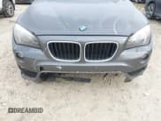 ✅ 2015 BMW X1 xDrive28i • VIN: WBAVL1C54FVY32220 • Lot: 43597221. Listed on IAAI with 127,463 mi. Free auction sales archive from the USA and detailed vehicle history report at DreamBid. Image 6.