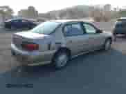 2000 Chevrolet Malibu z VIN 1G1ND52JXY6241997, wystawiony jako IAAI lot #42550617 z przebiegiem 130 503 mil mil oraz . Historia ofert i sprzedaży dostępna na DreamBid. Obrazek 4.