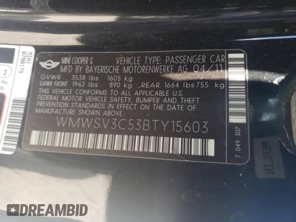 2011 MINI Hardtop S with VIN WMWSV3C53BTY15603, listed as a Copart auction lot 54893395 with 104,206 mi miles and Salvage title. Bid and sale history available at DreamBid. Image 12.