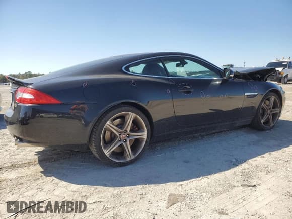 ✅ 2015 Jaguar XK XKR • VIN: SAJWA4DCXFMB55227 • Lot: 48455465. Listed on Copart with 64,050 mi. Free auction sales archive from the USA and detailed vehicle history report at DreamBid. Image 3.