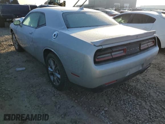 ✅ 2020 Dodge Challenger SXT • VIN: 2C3CDZGG5LH104559 • Lot: 77303443. Wystawiony na Copart z przebiegiem 23 923 mil. Bezpłatny archiwum sprzedaży aukcyjnych z USA i szczegółowy raport historii pojazdu na DreamBid. Zdjęcie 2.