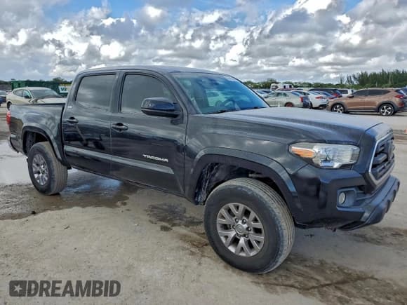 ✅ 2018 Toyota Tacoma TRD Sport • VIN: 3TMAZ5CN5JM066203 • Lot: 93886135. Listed on Copart with 83,867 mi. Free auction sales archive from the USA and detailed vehicle history report at DreamBid. Image 4.
