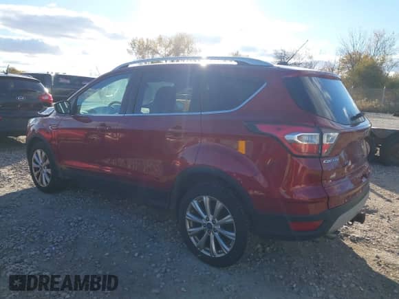 2017 Ford Escape Titanium z VIN 1FMCU9J94HUA64108, wystawiony jako IAAI lot #43571909 z przebiegiem 209 412 mil mil oraz . Historia ofert i sprzedaży dostępna na DreamBid. Obrazek 3.