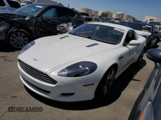 ✅ 2009 Aston Martin DB9 • VIN: SCFAD01E59GA10941 • Lot: 57220313. Wystawiony na Copart z przebiegiem 24 818 mil. Bezpłatny archiwum sprzedaży aukcyjnych z USA i szczegółowy raport historii pojazdu na DreamBid. Zdjęcie 1.