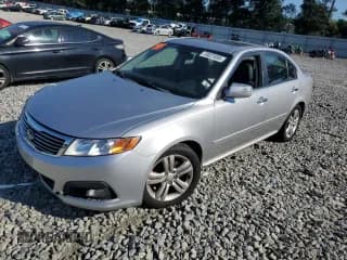 ✅ 2009 Kia Optima SX • VIN: KNAGE224595355870 • Lot: 70027695. Wystawiony na Copart z przebiegiem 128 959 mil. Bezpłatny archiwum sprzedaży aukcyjnych z USA i szczegółowy raport historii pojazdu na DreamBid. Zdjęcie 1.