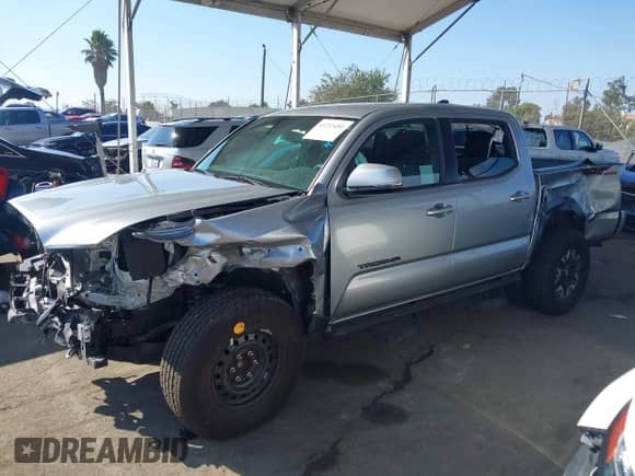 2022 Toyota Tacoma SR5 with VIN 3TMAZ5CN9NM186656, listed as a IAAI auction lot 43253480 with 25,540 mi miles and . Bid and sale history available at DreamBid. Image 2.